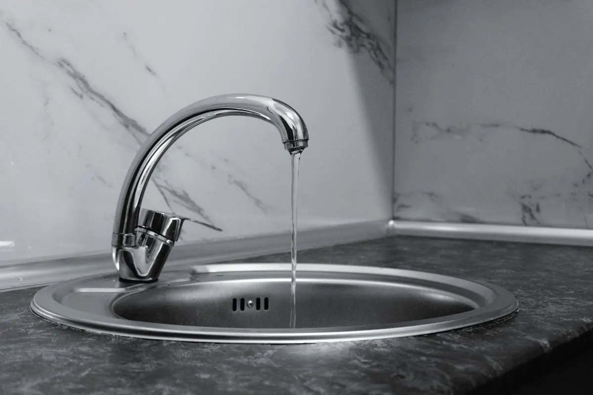 Clear glass of water being filled at a South Florida kitchen tap